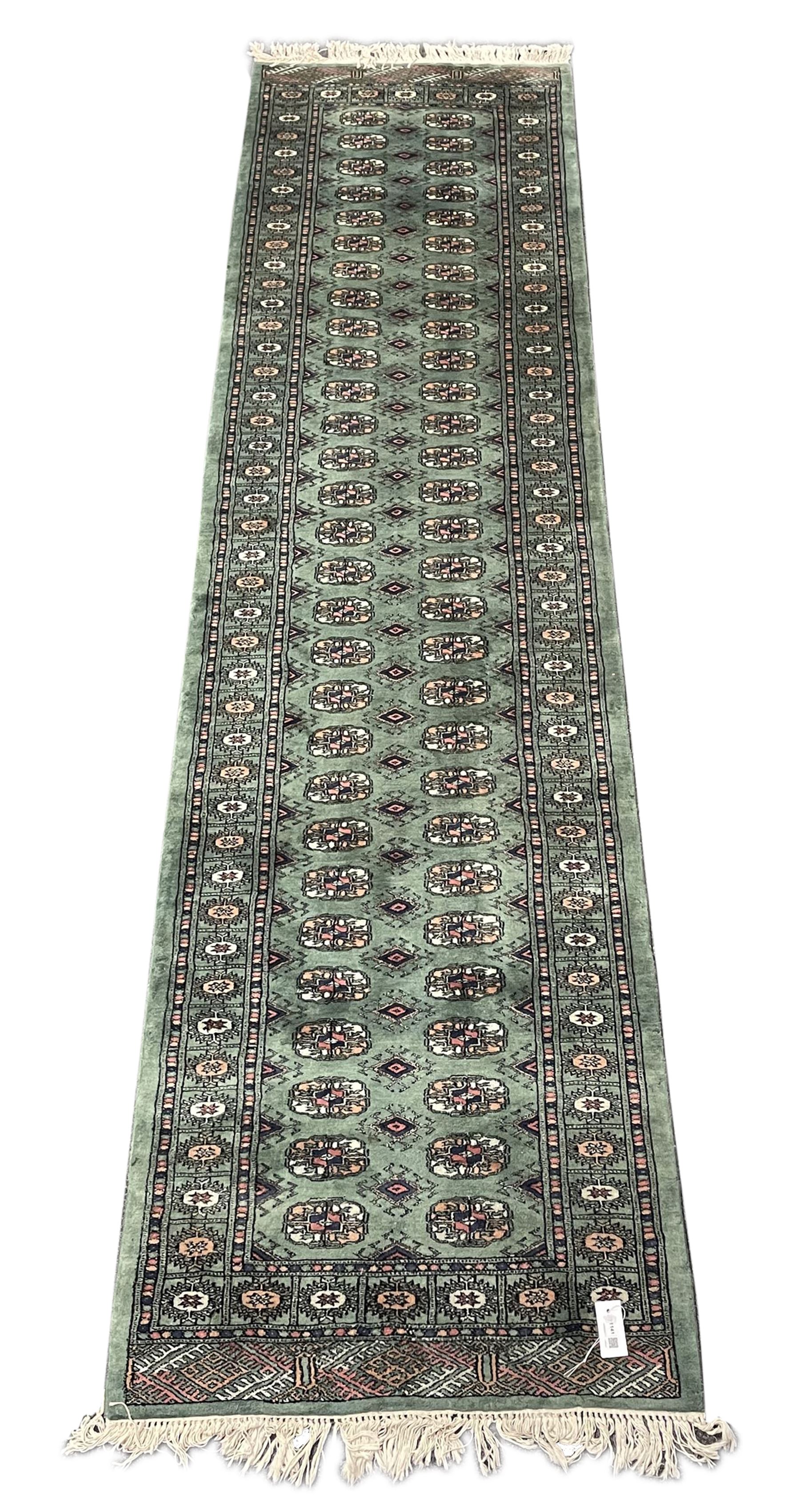 Persian Tekke Bokhara green ground runner rug 