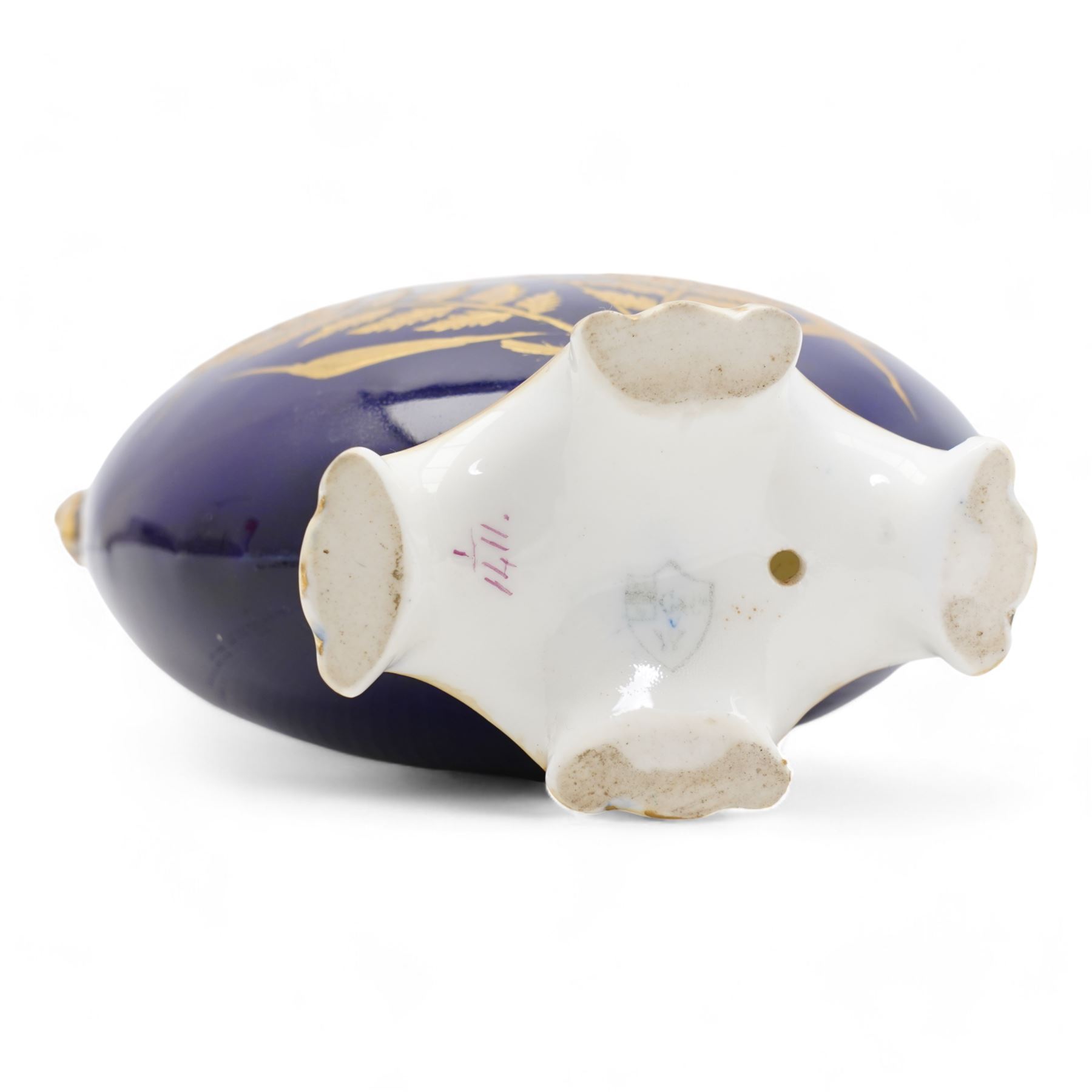 Early 20th century Royal Worcester loving cup, circa 1906, painted with a view of the River Severn and flowers to the reverse, H13cm, Grainger & Co. Worcester twin handled vase, the oval body painted in the Aesthetic style with ferns and grasses in gilt, against a cobalt blue ground, with scrolled handles and quatrefoil foot, H17cm (2)