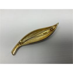 Christian Dior costume jewellery, comprising pair of pearlescent clip on earrings, enamel and paste leaf brooch and a pierced stylised leaf brooch, each stamped Chr.Dior Germany and in original boxes