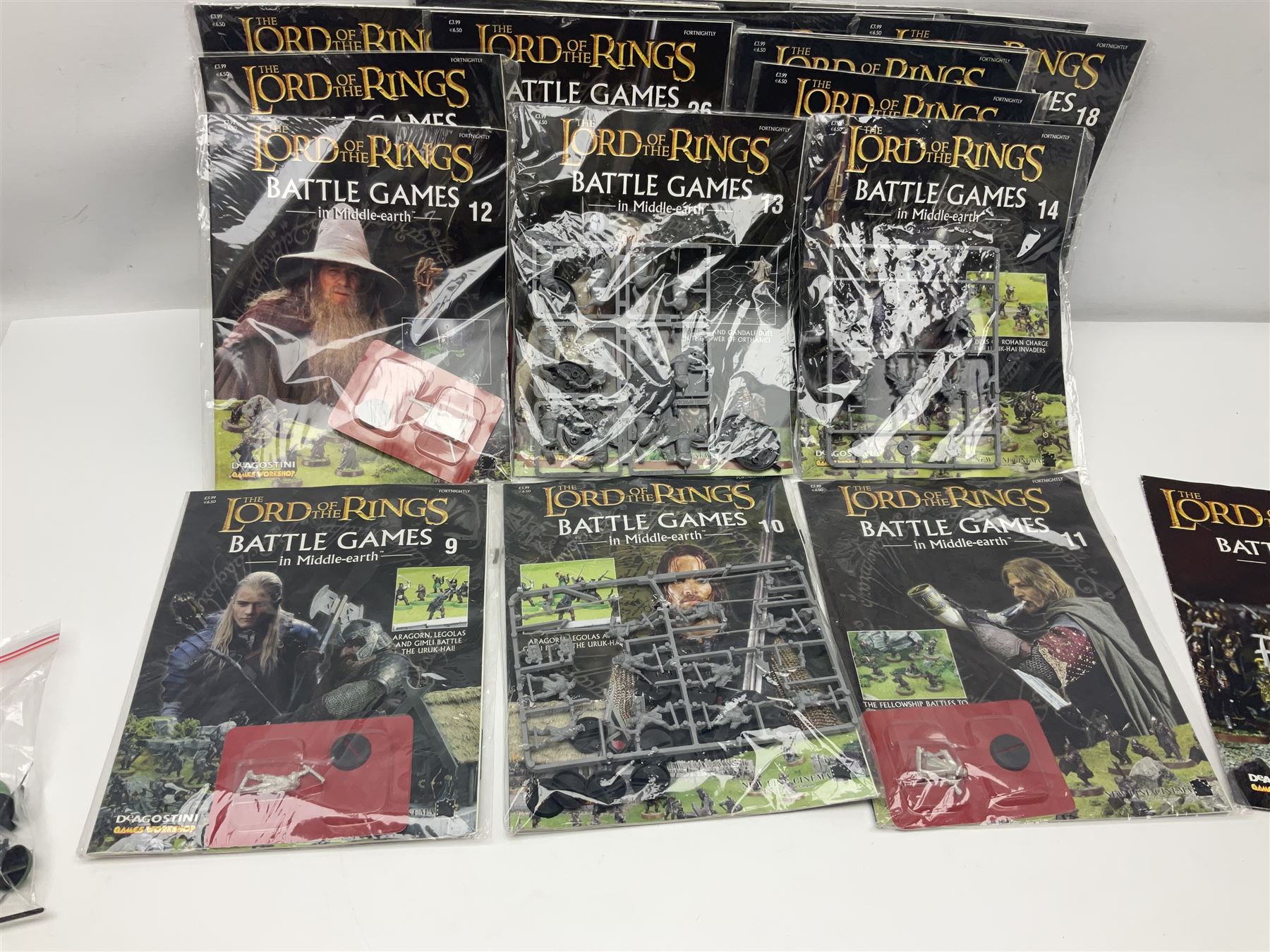 DeAgostini Lord of the Rings Battle Games in Middle-Earth magazines, issues 1 - 28 (lacking no.2), with models, all but one unopened, unbuilt and unpainted (27)