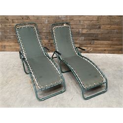 Pair metal framed folding sun loungers