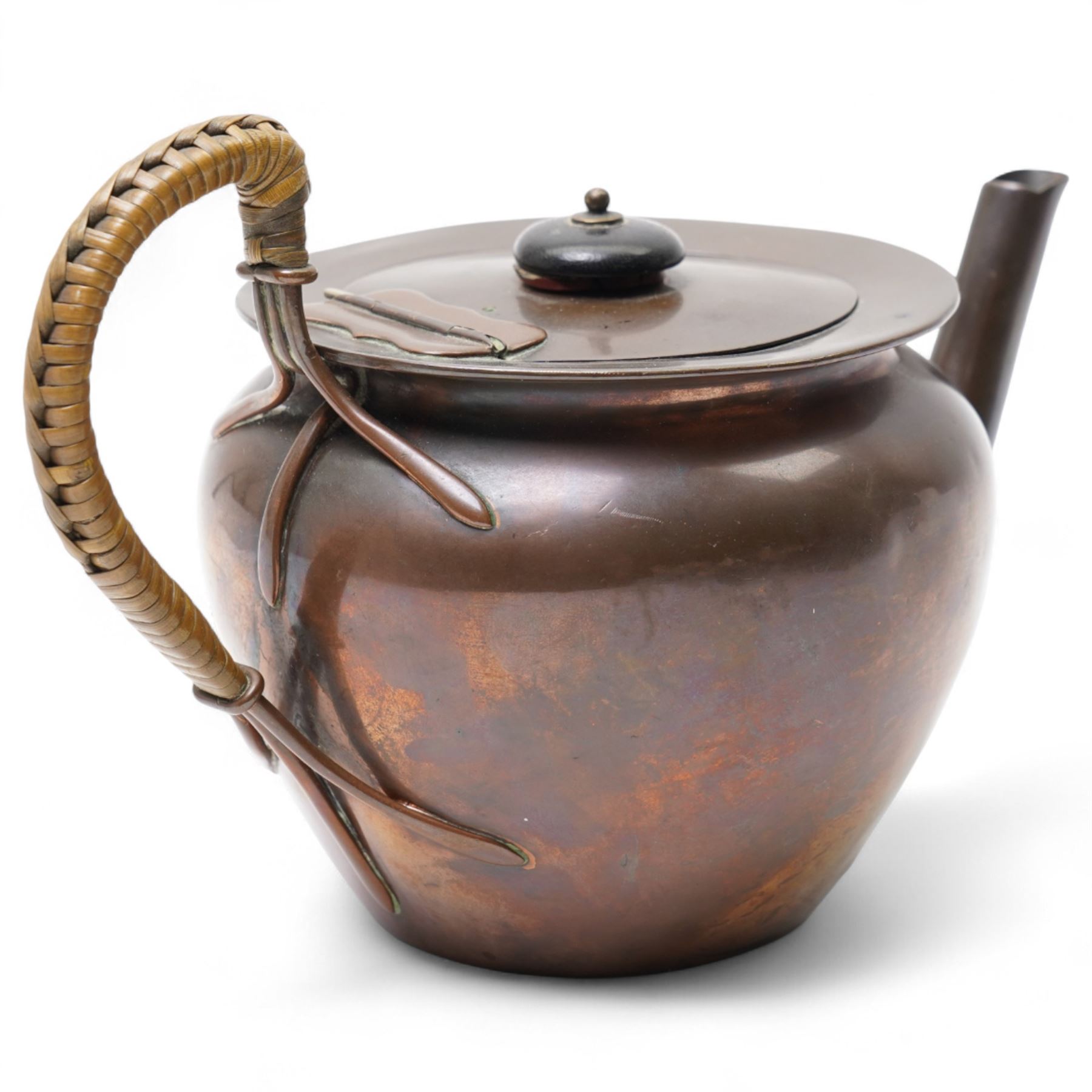Keswick School of Industrial Arts copper teapot, stylised form with cane wrapped handle, stamped to base KSIA, H13cm 