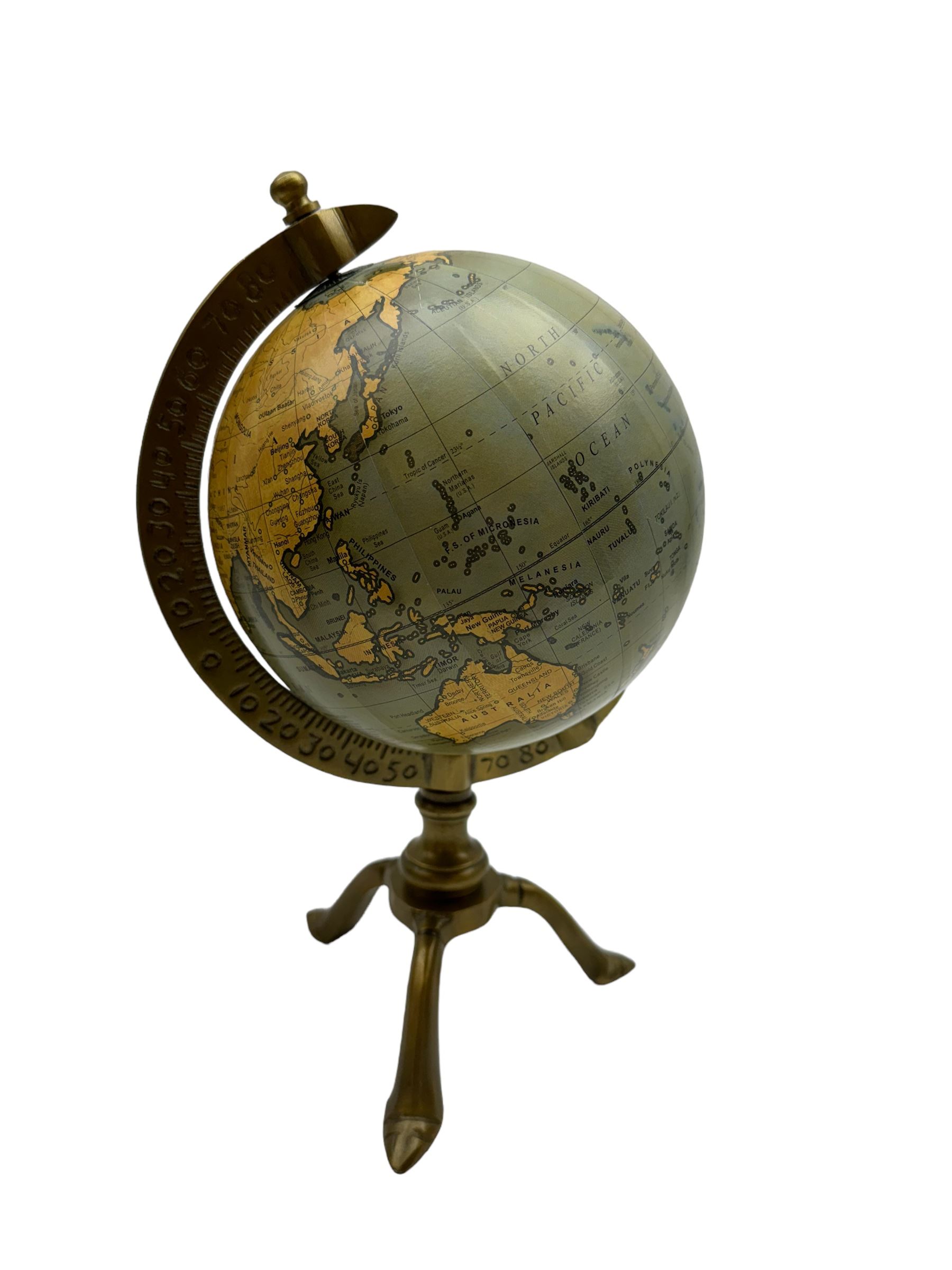 Terrestrial globe, raised on a tripod base, H30cm