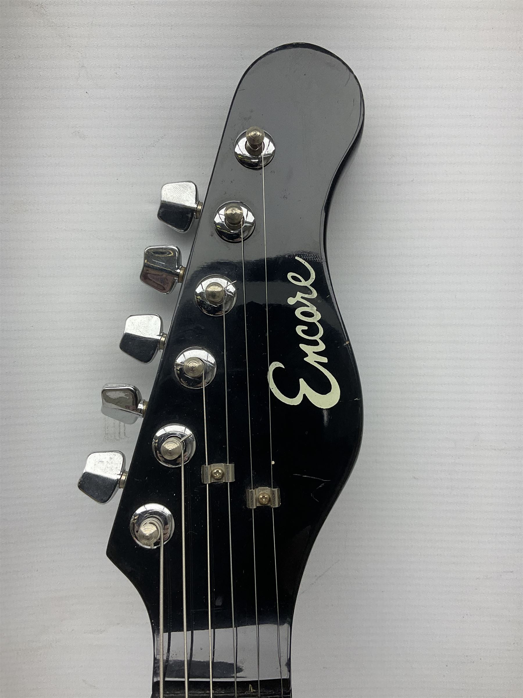 Encore black electric cut-away guitar L96cm; and Spanish Victor Garcia model 187 acoustic guitar, bears label dated 1972 L99cm; each in soft carrying case (2)