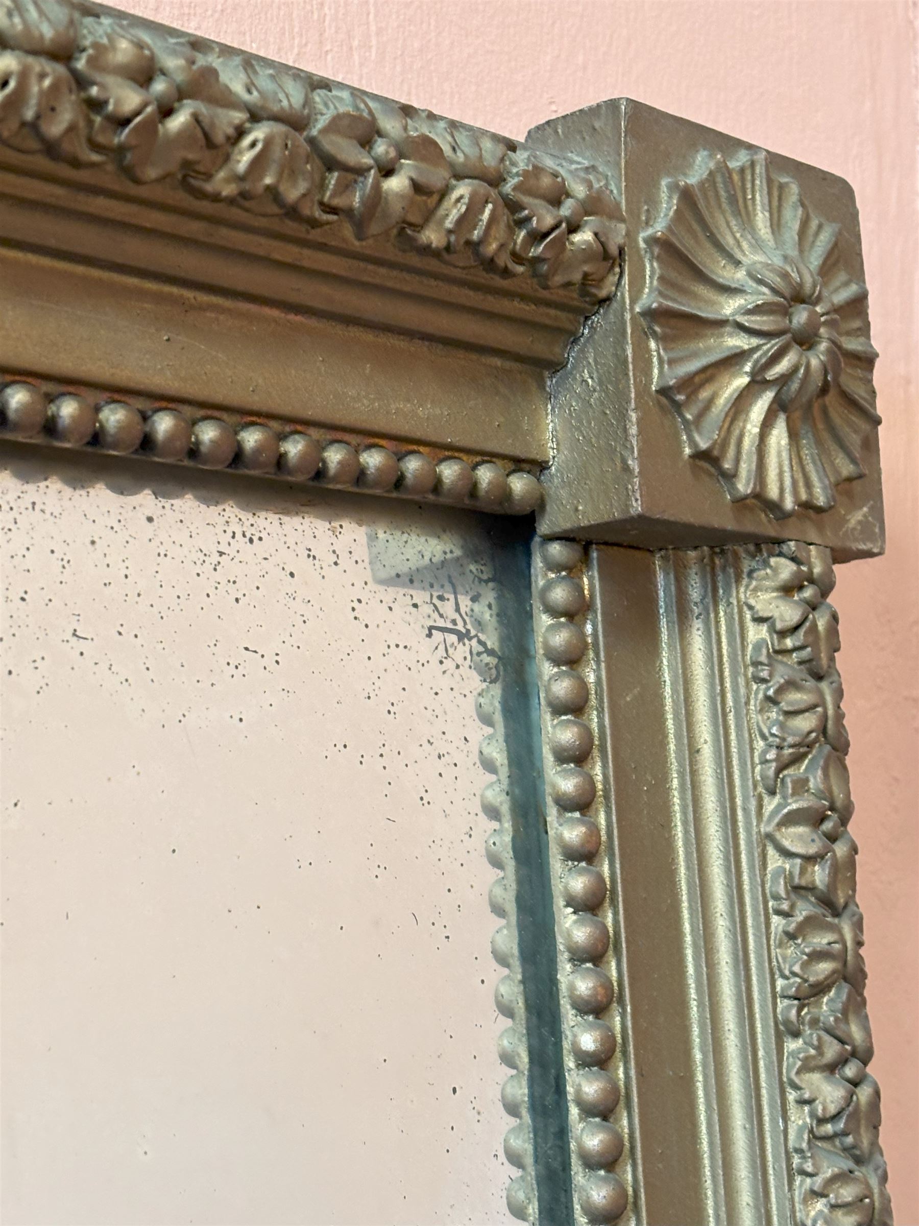 Edwardian giltwood and composition framed upright wall mirror, having a floral boss to each corner united by flowerhead decoration, enclosing an original distressed mirror plate. 193cm x 77cm.  - COLLECTION BY APPOINTMENT FROM: The White House, Thirsk Road, Easingwold, York, YO61 3NF - CALL 01723 507111 TO ARRANGE