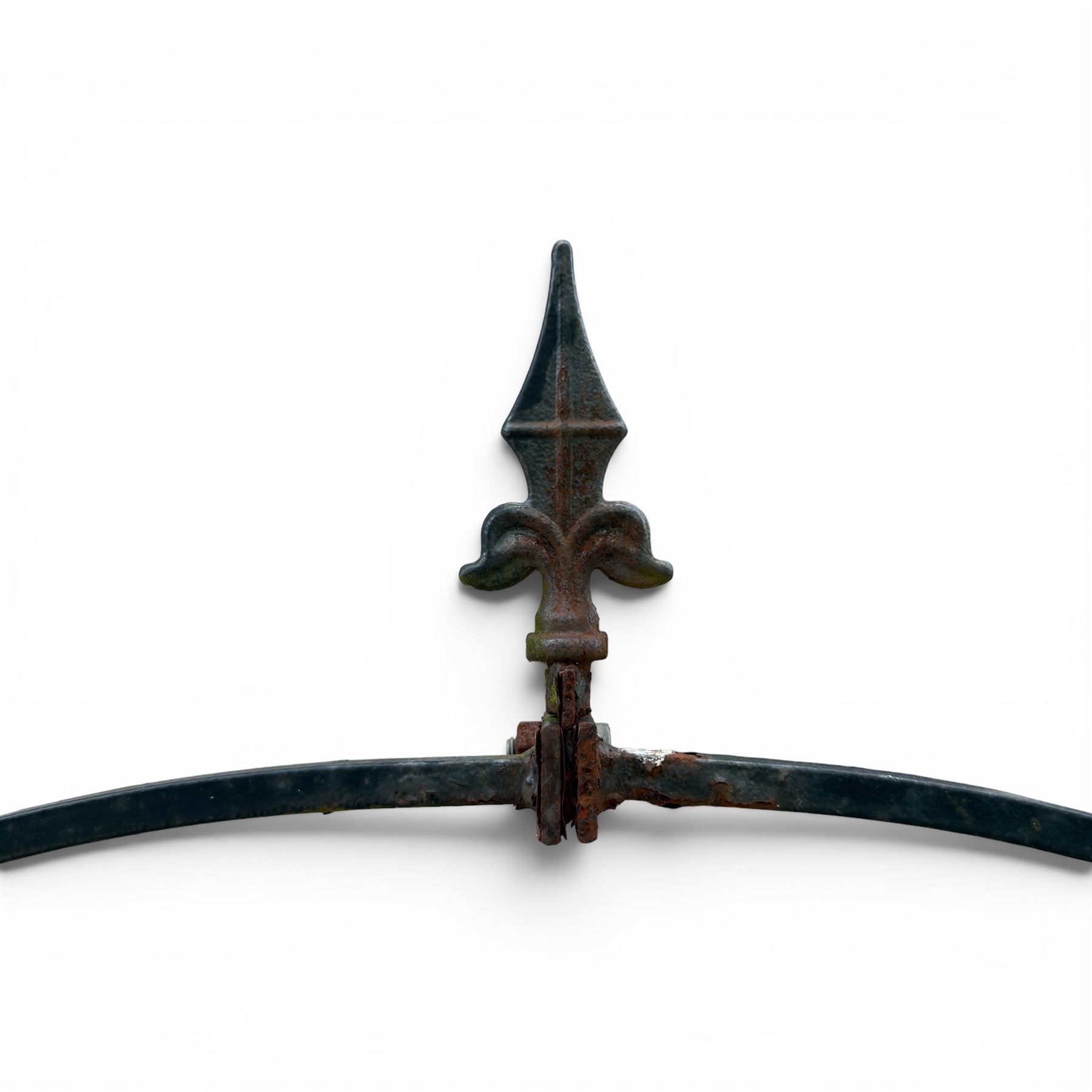 Antique wrought iron strapwork garden arch, with scroll form arched top with spearhead finials, over integral side trellis panels, in distressed black-painted finish