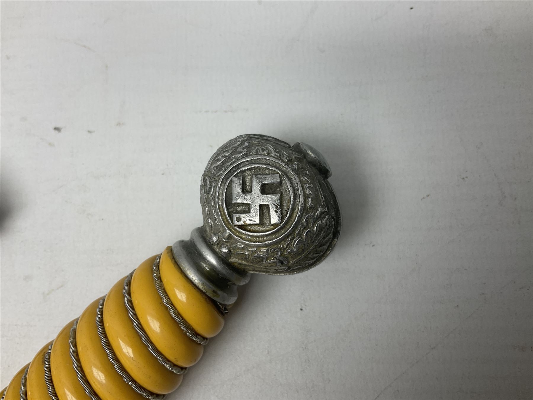 WW2 German Luftwaffe 2nd Pattern Officers dress dagger, with unmarked 25.5cm double edged steel blade, wire-bound pale orange/yellow celluloid grip, globular  pommel with oak leaves and traces of gilding, Luftwaffe eagle cross guard; in beaded scabbard with two suspension rings L43cm overall
