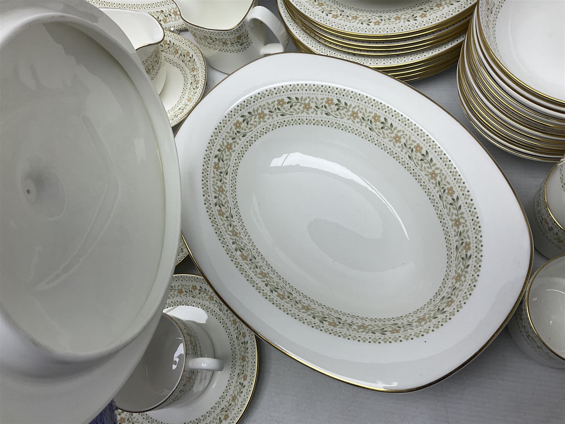 Royal Doulton Paisley pattern tea and dinner service for twelve, comprising dinner plates, side plates, soup bowls, dessert bowls, tea plates, two lidded tureens, sauce boat and saucer, sucrier and jug, oval serving dish and teacups and saucers