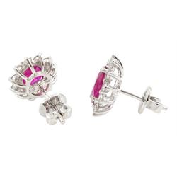 Pair of 18ct white gold oval cut ruby and round brilliant cut diamond stud earrings, stamped, total ruby weight 1.85 carat, total diamond weight 0.50 carat