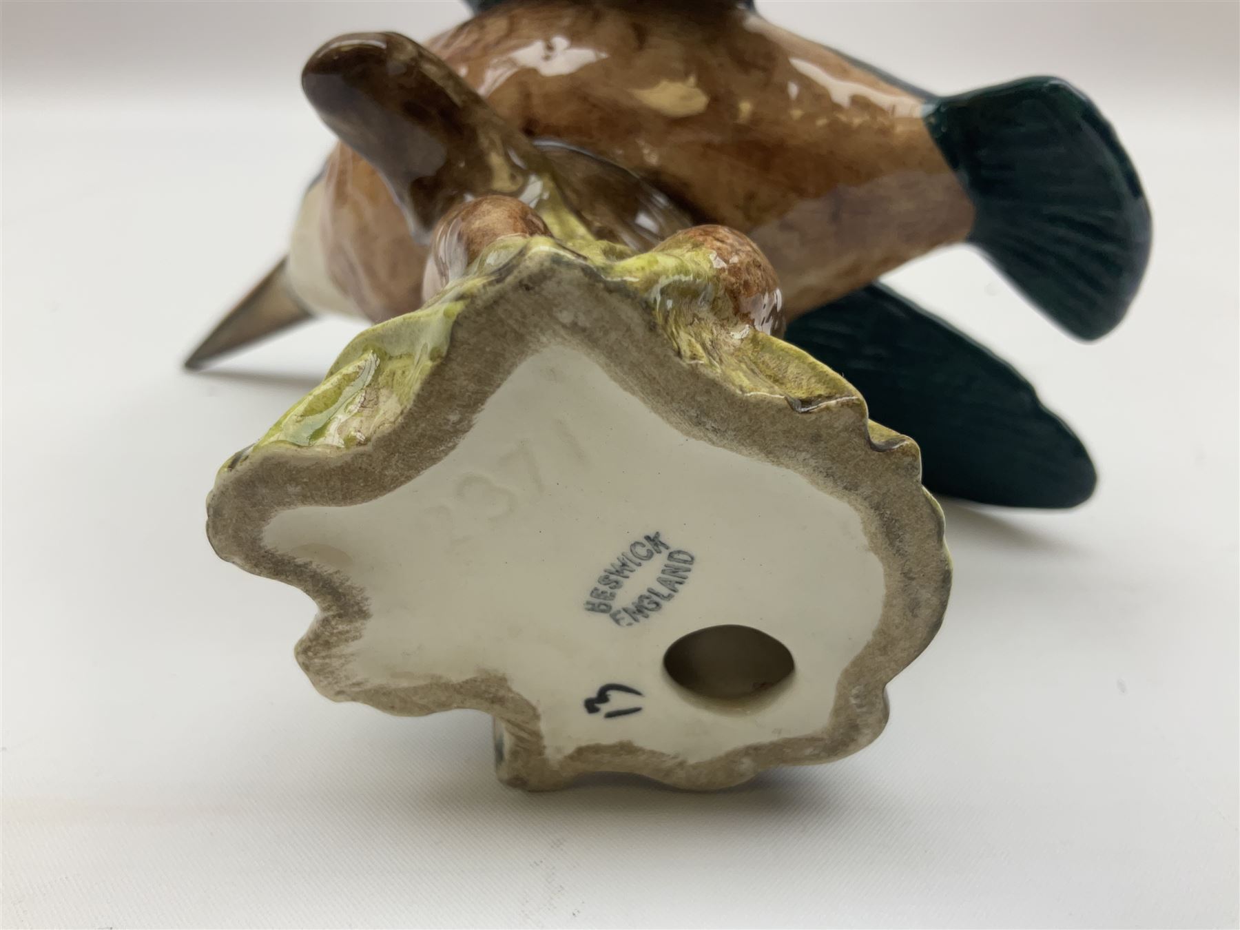 Karl Ens figure of a green woodpecker, modelled perched upon branch, model no. 7527, together with Karl Ens figure of budgie and Beswick Kingfisher no. 2371, all with printed marks beneath, tallest H25cm