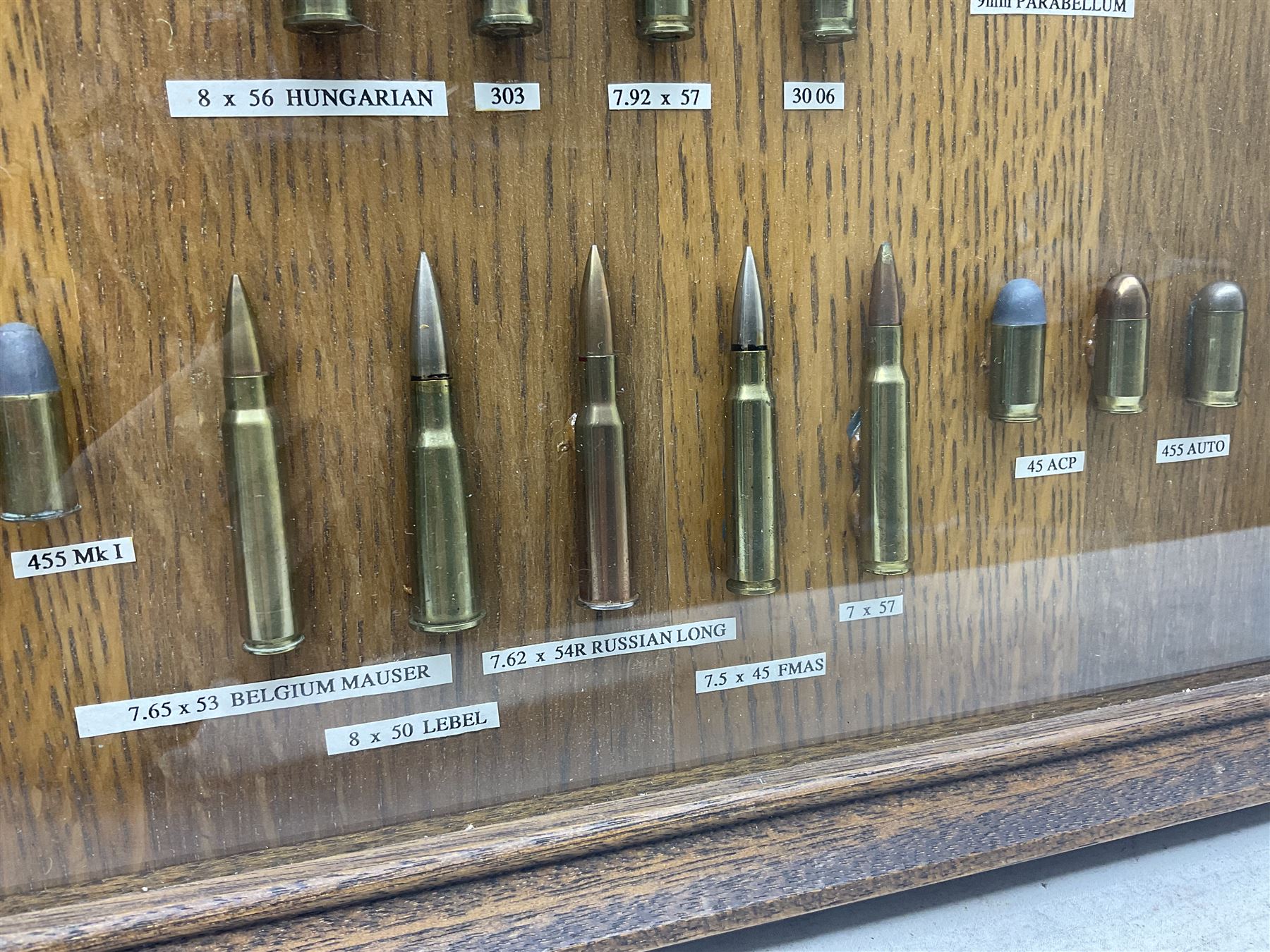 SECTION 1 FIRE-ARMS CERTIFICATE REQUIRED - Two cased specimen displays of annotated ammunition/cartridges - one entitled 'First World War Collection' containing twenty items including 7.63 Mauser, 7.65 Luger, .303, 7.62 x 54R Russian long, 455 Mk.II lead, 455 Auto etc; the other with sixteen items/clips including Musket cartridge, .577 Snider-Enfield, .577/45 Martini Henry, .303 Enfield Magazine, 7.62 Charger Clip, Specialised .303 rounds etc; largest case 41 x 76cm (2)