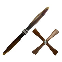 British World War II era laminated wooden four-bladed generator propeller, late 1930s-40s, used to power a drogue winch used by a target tug aircraft; marked with DRG drawing number T29505-2-4 N760 on the hub and impressed circle mark 'P.M.P.W. 1'; light weight four plank mahogany laminate with 9.5cm diameter metal plates mounted to front and rear faces of hub for 15mm shaft; one plate marked T29504-2/198 D91cm; together with a modern reproduction brass edged mahogany two-blade propellor L
