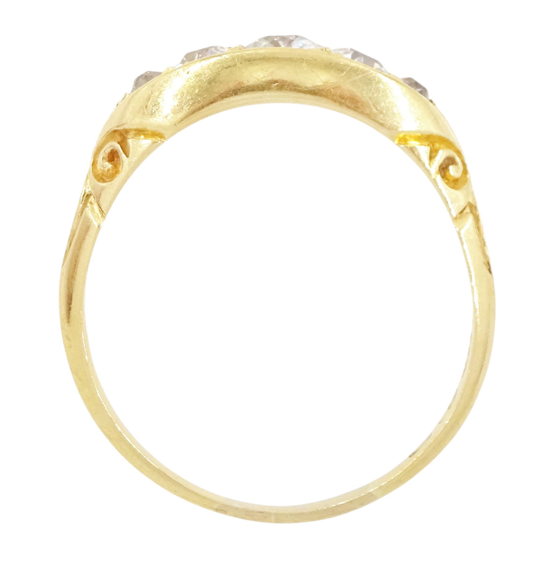 Early 20th century 18ct gold five stone diamond ring, set with five graduating old cut diamonds, with scroll design shoulders, hallmarked, total diamond weight approx 0.60 carat
