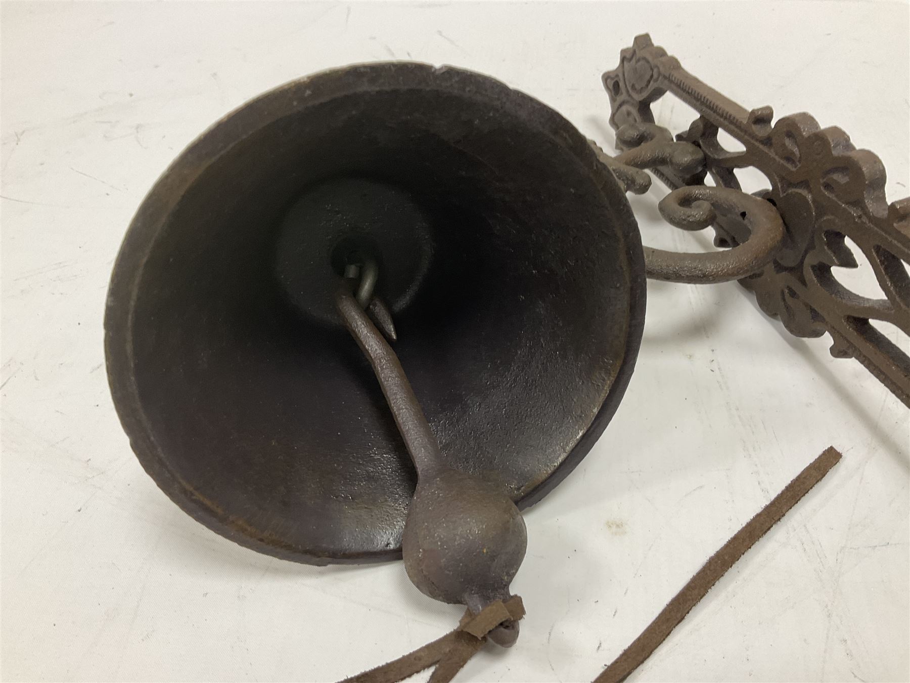 Cast iron exterior hanging garden bell with decorative butterfly bracket