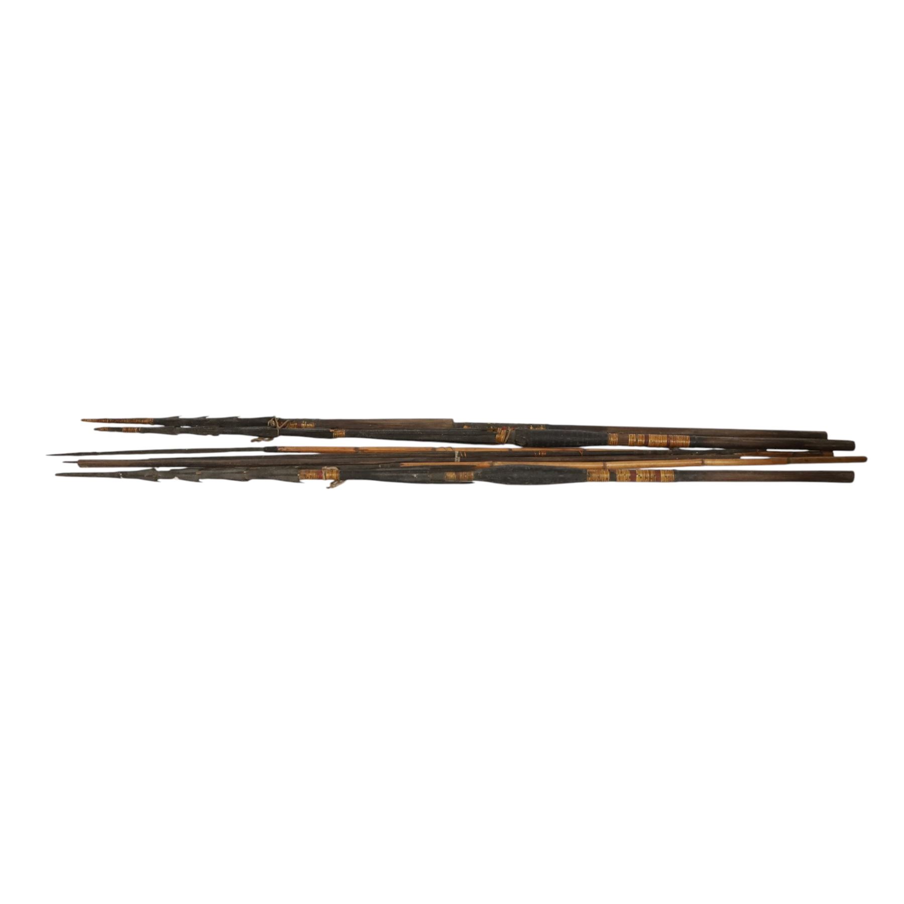 Papua New Guinea tribal fishing spears, together with carved boat 