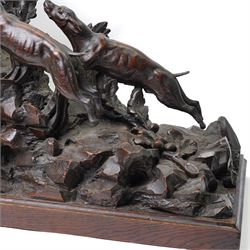 19th-century-8-day German Black Forest mantel clock c1880, with a carved oak case depicting a hunting scene with a stag pursued by hounds amidst rockwork and oak foliage, fitted with a French Parisian movement with a cast brass dial enclosed within a glazed brass bezel with a pendulum adjustment arbor, cartouche blue-on-white enamel  Roman numerals, engraved five minute Arabic's and contrasting steel Fleur-di-Lis hands, twin train going barrel movement with a recoil anchor escapement and countwheel strike. With pendulum.  