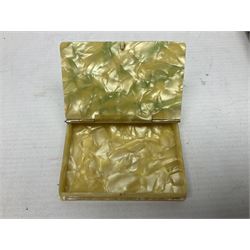 Mother of pearl and abalone inlaid card case, with central diamond shaped panel engraved with foliate decoration, together with a simulated mother of pearl card case of book form with green sun rays to cover, and simulated wood effect cigarette case with hinged lid with diamante style banding, largest L10cm