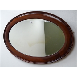  Chippendale style walnut fret work parcel gilt wall mirror, (W50cm, H93cm) and an oval bevel edge mirror (W81cm, H54cm)  