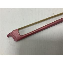 Zest full size pink violin, with a solid wood body and maple head, with matching pink bow and two further bows, in a hard case Length 60cm