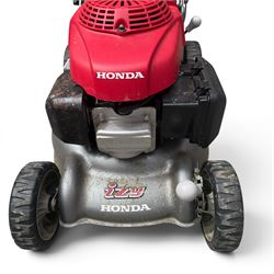 Honda -  GCV160 petrol lawnmower, Izy model, with rear grass collector, grey deck and red engine cover.