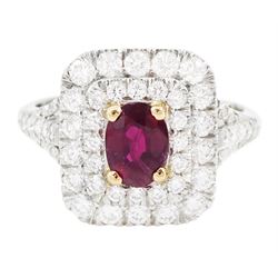 Platinum ruby diamond cluster ring, single oval cut ruby  in a four claw 18ct rose gold se...