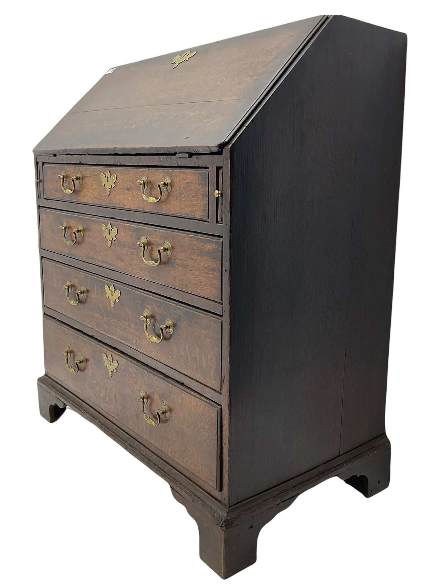 Georgian oak bureau, fall front enclosing fitted interior, four long graduating drawers, on bracket feet