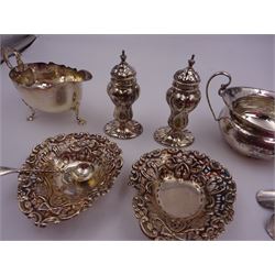 Group of silver, comprising pair of pepper shakers, bon bon dishes, milk jug, sugar bowl and spoon, all hallmarked 