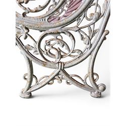 Large late Victorian cast iron garden bench, serpentine form with scroll back and seat, slatted with mahogany stained Sapele