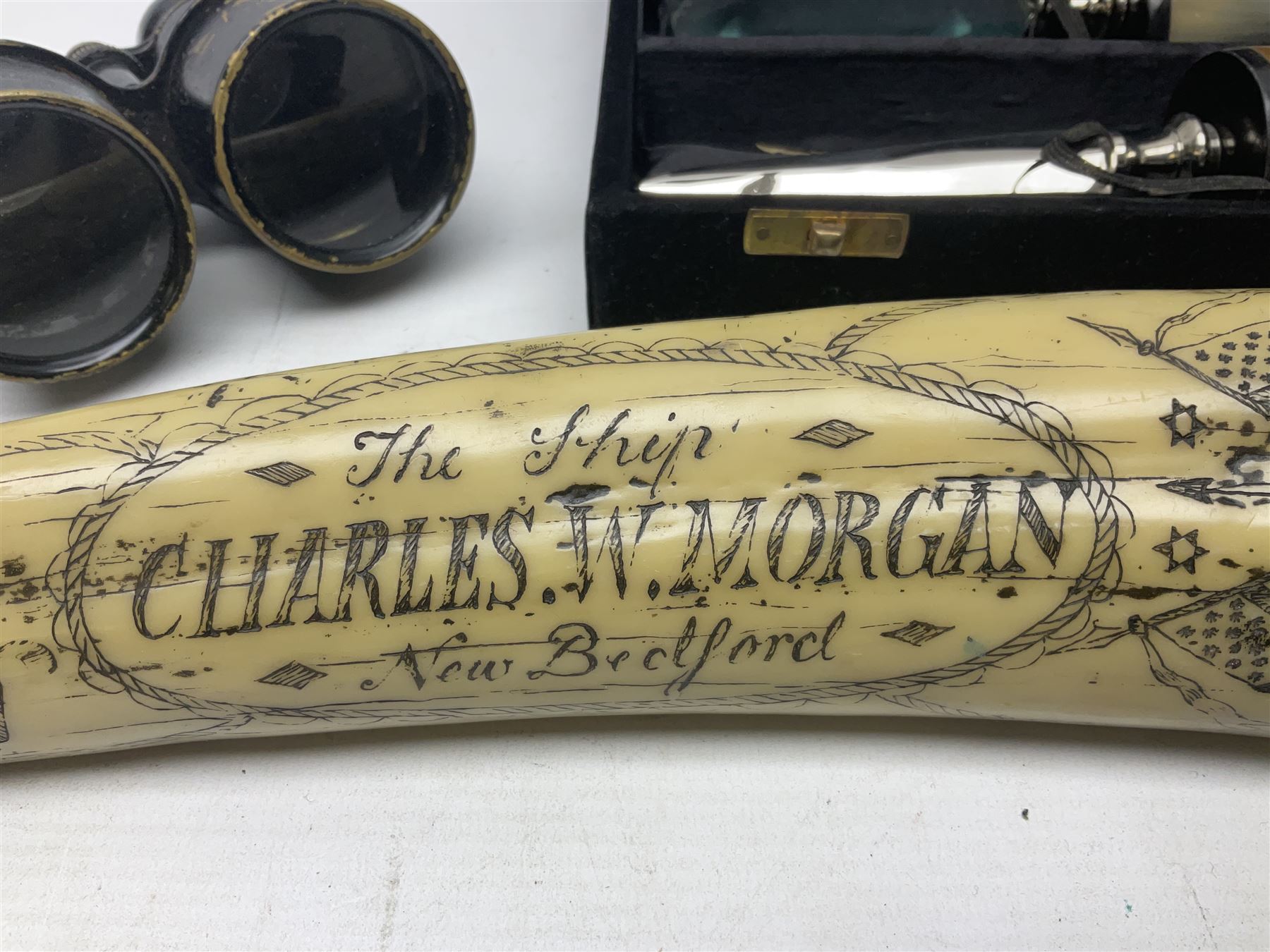 Horn handled magnifying glass and letter opener cased set, replica Scrimshaw in the form of a tusk titled The Ship Charles W Morgan New Bedford and pair of binoculars