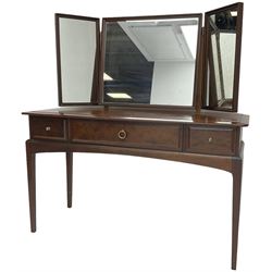 Stag Minstrel mahogany dressing table, raised triple mirror back over three drawers (W120cm, H127cm, D50cm); and a matching bedside cupboard (W40cm, H65cm, D31cm)