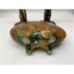 Linthorpe pottery vase with crimped rim and ovoid body, Linthorpe jug with high loop handle and crimped spout, a pair of candlesticks with a green, brown glaze and other similar pottery 