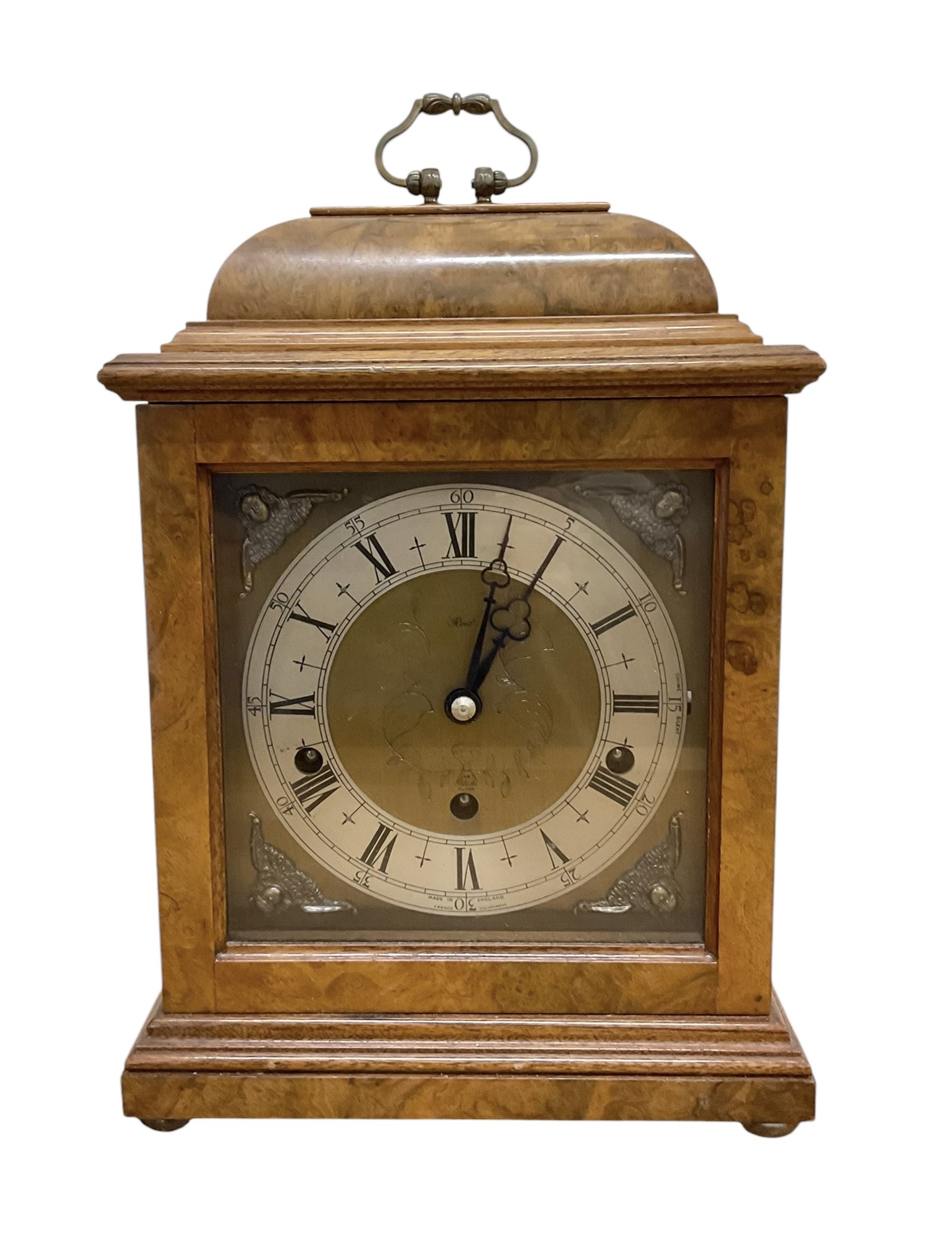 Elliot- late 20th century 8-day walnut bracket clock in an 18th century styled case, with a brass dial, brass spandrels and a slivered chapter ring, three train Westminster chiming movement with a lever balance escapement, chiming the quarters on eight gong rods.