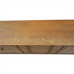 Ensign - Mid-20th century elm sideboard, with a central bank of four drawers, flanked by cupboard doors, raised on tapering supports, labelled Ensign Bristow & Townsend Ltd