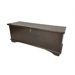 18th century oak sword chest or coffer, hinged lid with moulded edge and iron fittings concealing candle box and main compartment, the front with studwork spelling 'TC 1750', raised on bracket feet