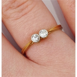 Early 20th century gold two stone milgrain set old cut diamond ring, stamped 18ct