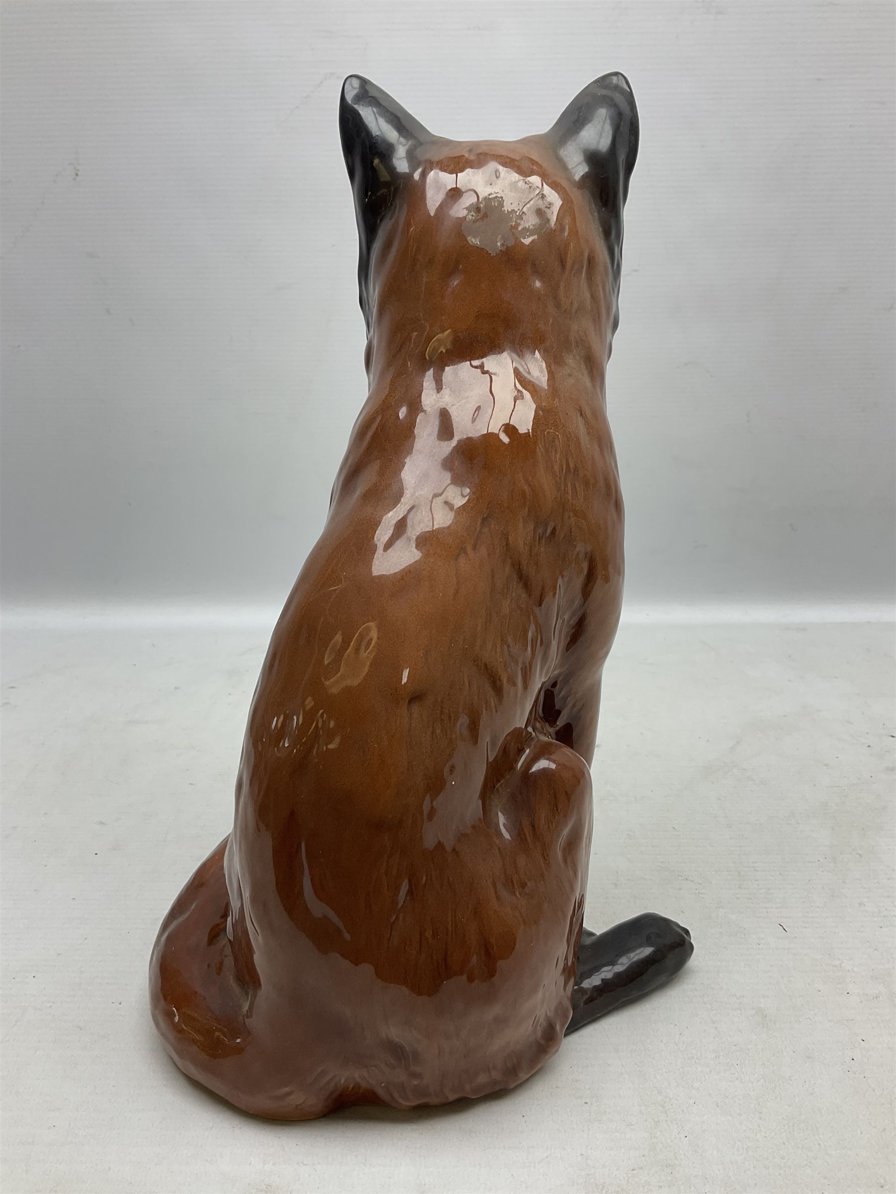 Beswick large fireside fox figure, modelled seated, no 2348, with impressed marks beneath, H31cm