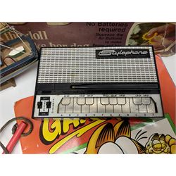 Two boxed Bradgate Penny Puppywalker dolls; Garfield soft toy and Panini sticker album; boxed Stylophone with instructional 45rpm record; and other toys
