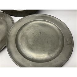 Group of seven 19th century pewter chargers, each of circular form with dished centre, two examples with touch marks verso, each approximately D39cm