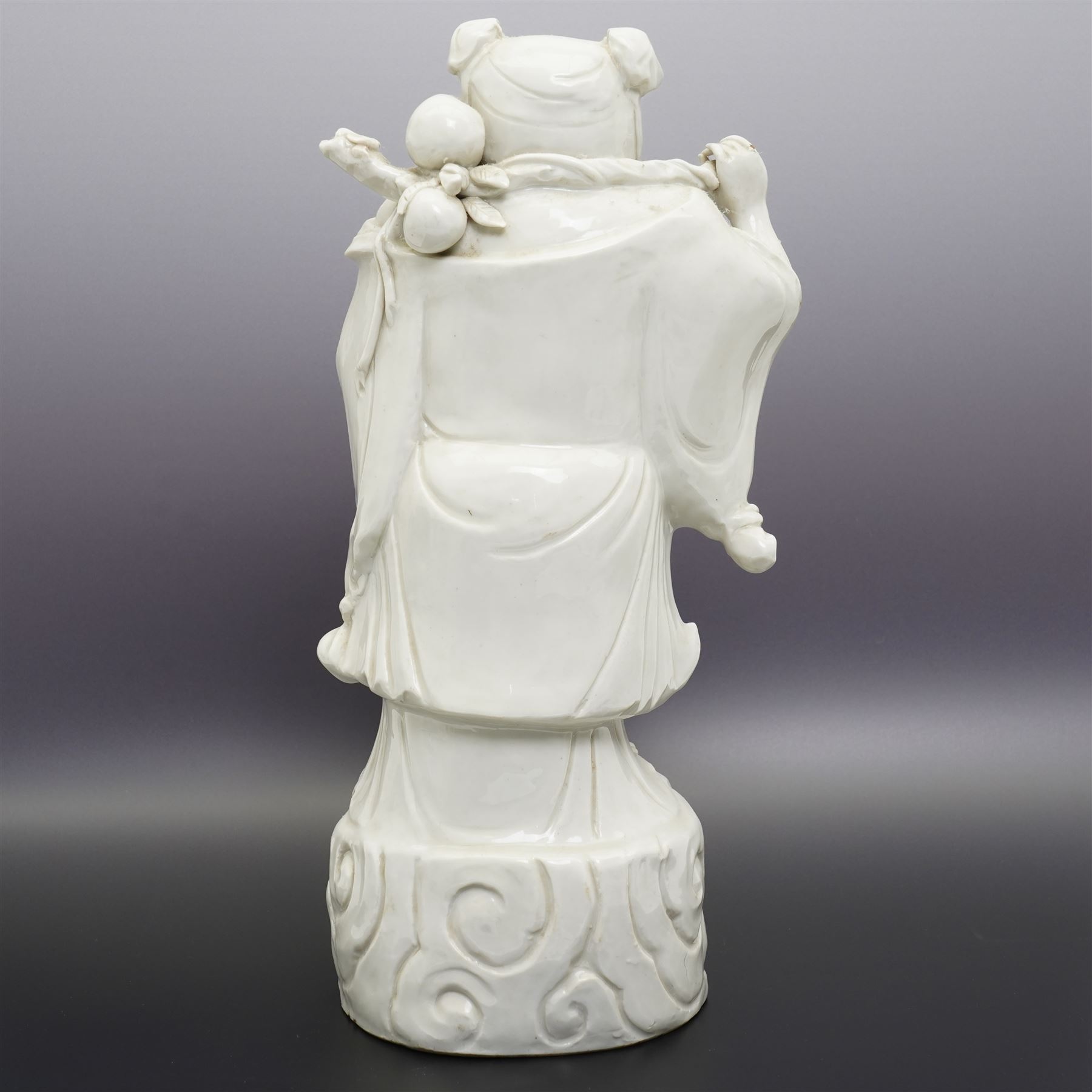 Chinese blanc de chine figure of Shou Lao, standing upon a cloud, H36cm 