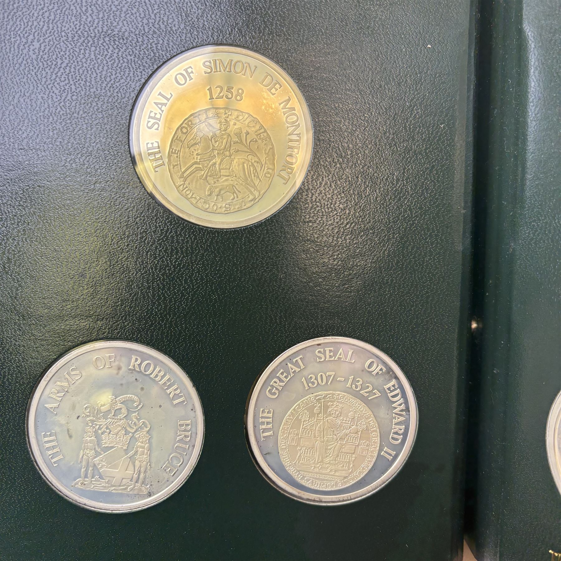 Limited Edition Danbury Mint 'History of the English Speaking Peoples' complete set of fifty silver medallions, each depicting historical figures and scenes from Julius Caesar Lands 55BC to Second World War 1939AD, contained within leatherette folder with personalised presentation to cover and interior, no. 2780/7500