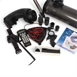 Celestron Nexstar 130SLT stargazing telescope, on a tripod stand, with lenses and other accessories