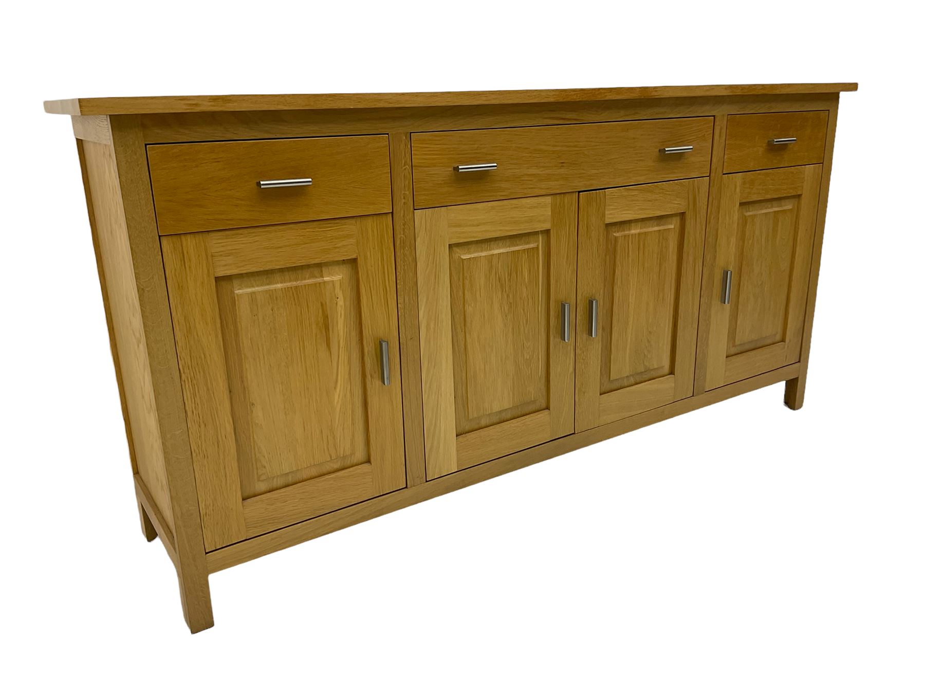 G-Plan - light oak sideboard, fitted with three drawers and four panelled cupboards