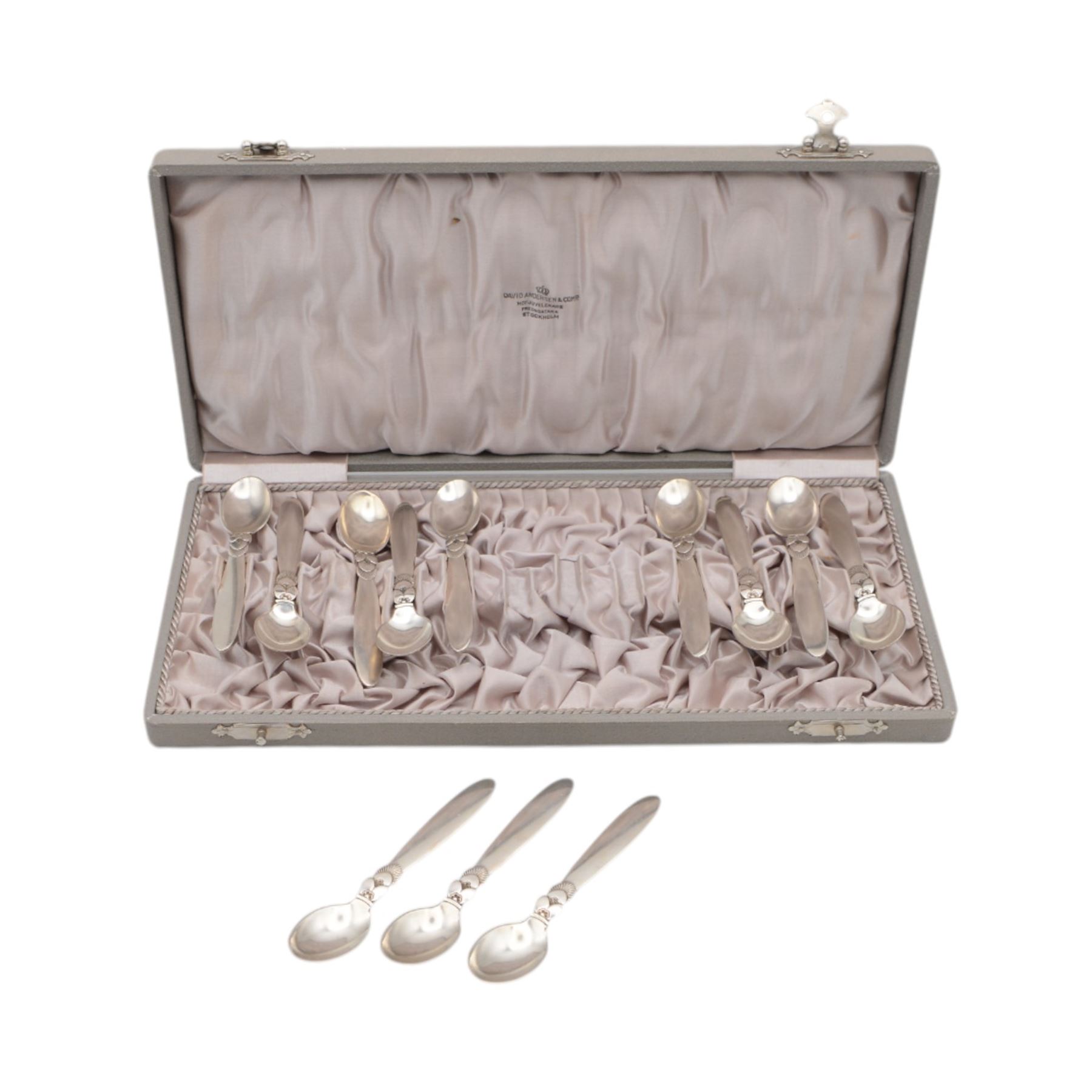 Set of twelve early 20th century Danish silver Cactus pattern demitasse spoons by Georg Jensen, marked for Georg Jensen, Denmark, also marked with Swedish national control mark and S standard mark for minimum 800 standard silver, contained within tooled leather David Andersen case with silk interior