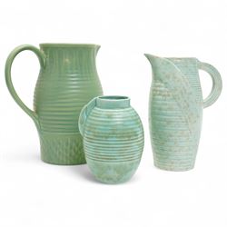 Susie Cooper pottery jug, the green glazed body with ring turned and dimpled decoration, i...