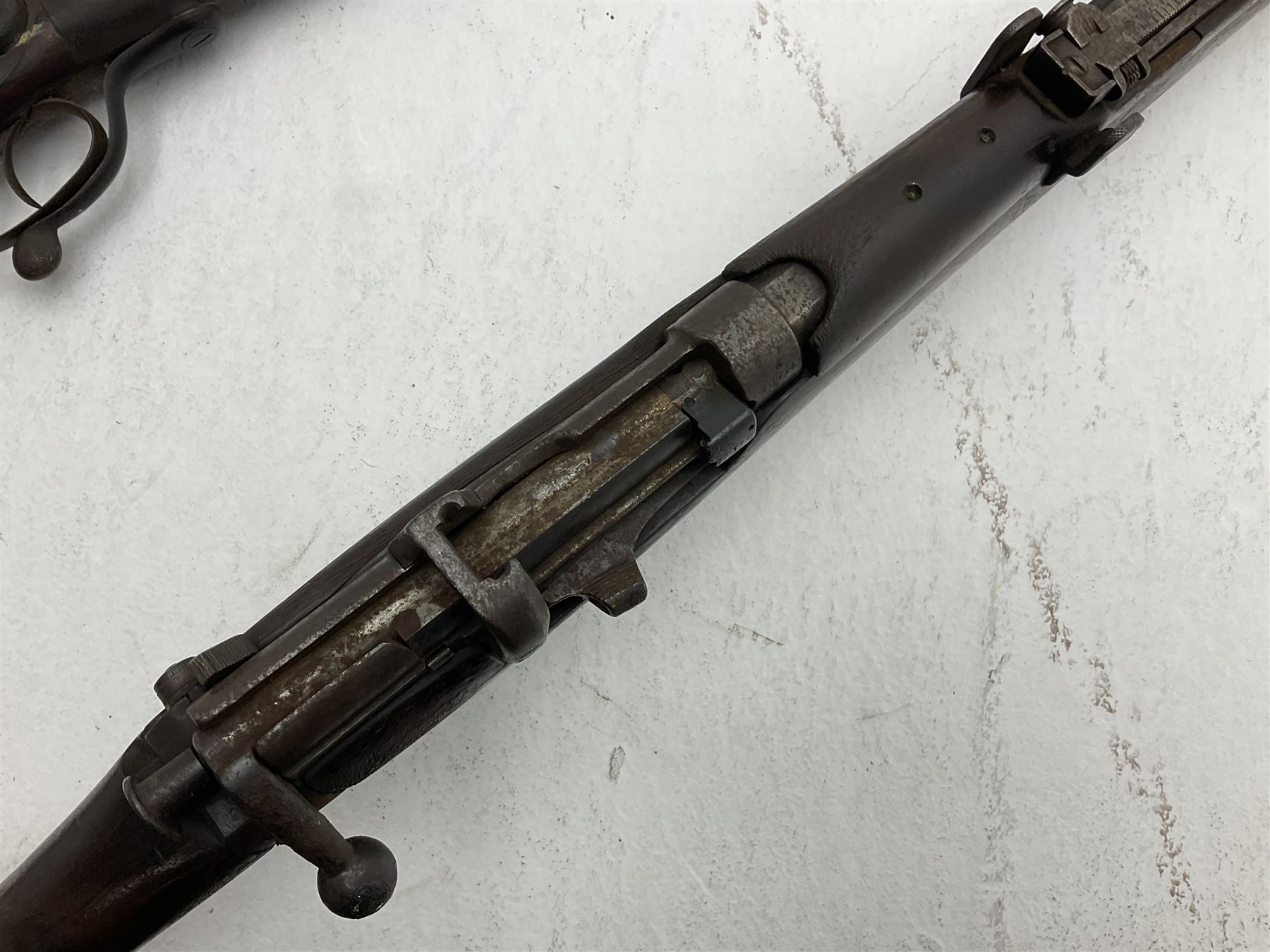 WW1 Lee Enfield SMLE .303 bolt action rifle with 63.5cm barrel and magazine; No.20934; L112cm overall; home deactivated by welding down bolt and end of barrel so requires re-deactivation to modern standards; and 19th century 12-bore double barrel hammer shotgun with 65cm cut-down barrels, non-rebounding hammers and under-lever opening, the lock-plate indistinctly inscribed G.T. Bartrant(?) L75cm overall; home deactivated by welding both barrels closed at breech so requires re-deactivation to modern standards (2) RFD ONLY 