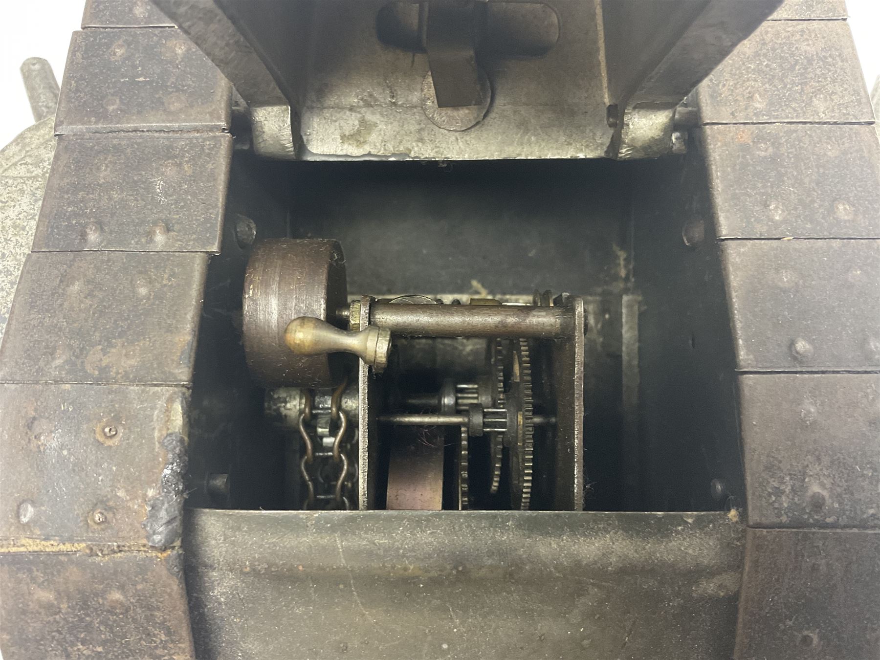Large clockwork model of a WW1 Tank made of tin-plate and aluminium, with moving side cannons, the clockwork chain driven movement driving the articulated tin tracks; L28.5cms  W16.5cms and H13.5cms