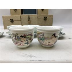 Two Chinese Yixing teapots, Chinese tea bowl hand painted with figures reading, another tea bowl with with underglaze floral panel and another tea bowl with saucer and lid, together with other teacups etc all boxed and with character marks