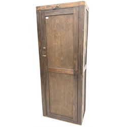 Early 20th century large stained pine school cupboard, single panelled door enclosing shelving 