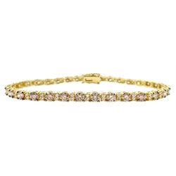 Gold round brilliant cut diamond champagne and white diamond bracelet, tested to 14ct, total diamond weight approx 4.85 carat