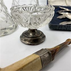 Group of silver mounted items, including cut glass sugar sifter with silver cover, cut glass dressing table bottle, shoe horns, clothes brush, buttonhook and comb with silver handles, etc and a set of silver plated coffee spoons in fitted case